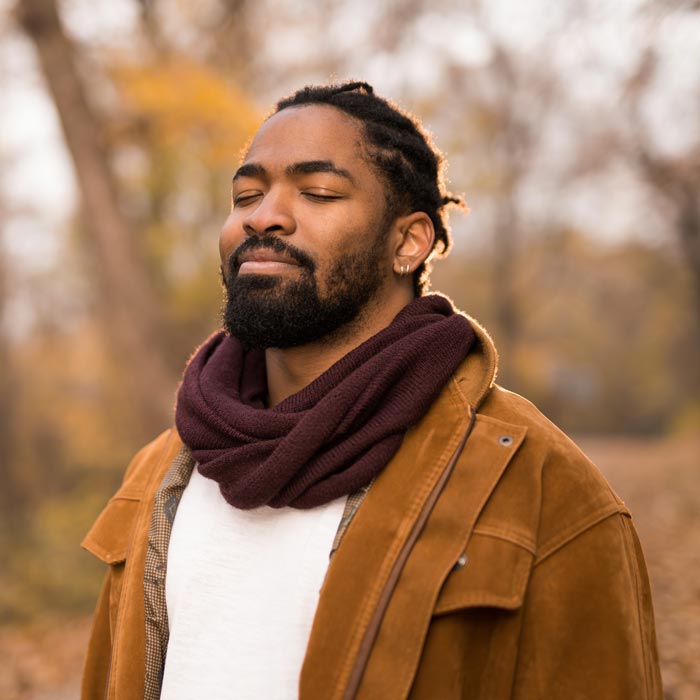 A man feeling relieved after a successful pain relief treatment in Maryland