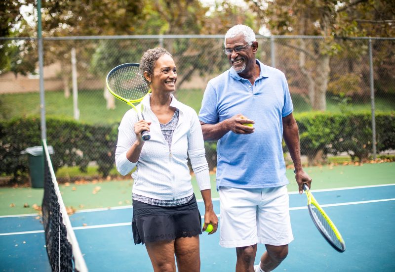 An older couple is enjoying playing tennis together in Maryland