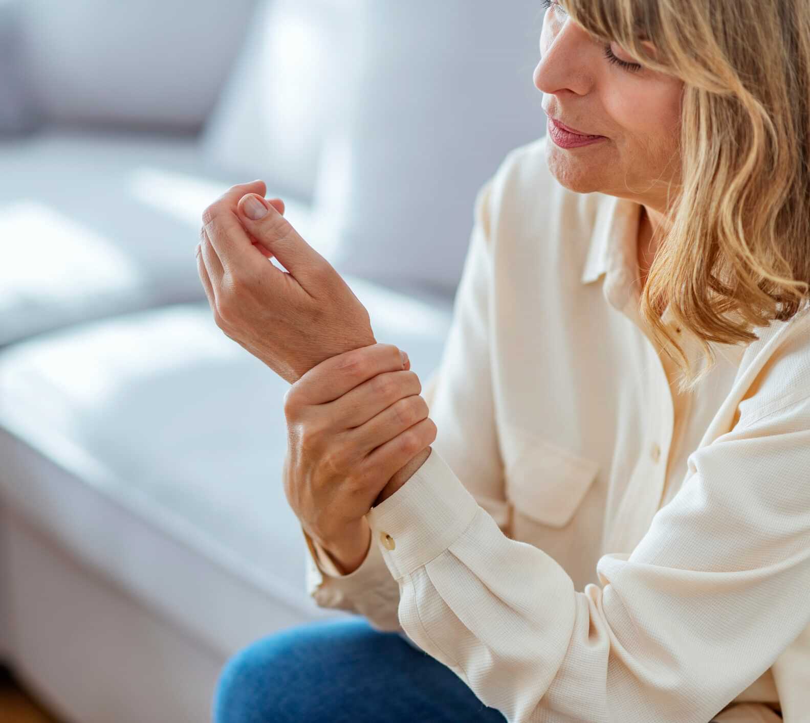 A woman Experiencing pain in her hand in Greater Maryland
