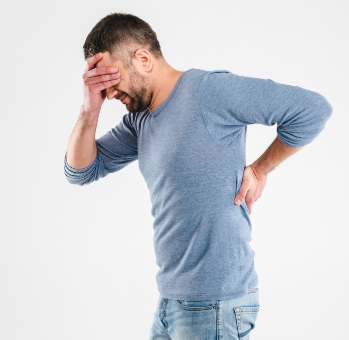 Man suffering Back pain and headache in Maryland