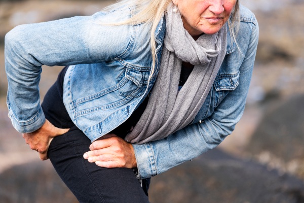 Older woman struggling with hip pain