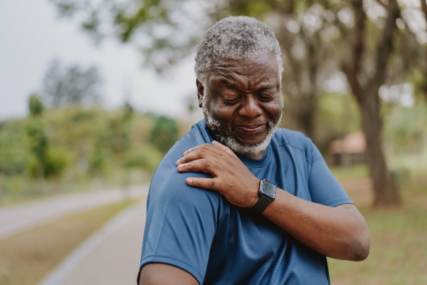 Man experiencing arm pain