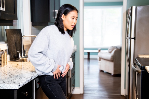 Woman experiencing groin pain