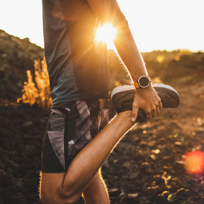 man stretching before run