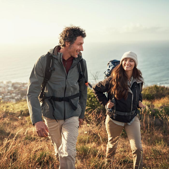 A boy and a girl hiking pain free outdoors in Maryland