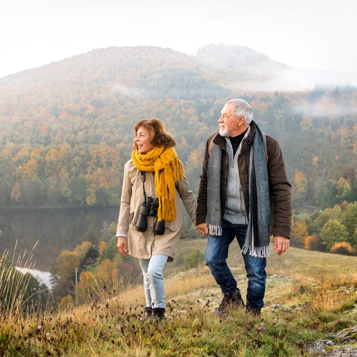 The old couples walking on hills 